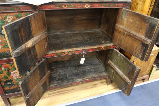 An Eastern painted and decorated pine cabinet W.127cm